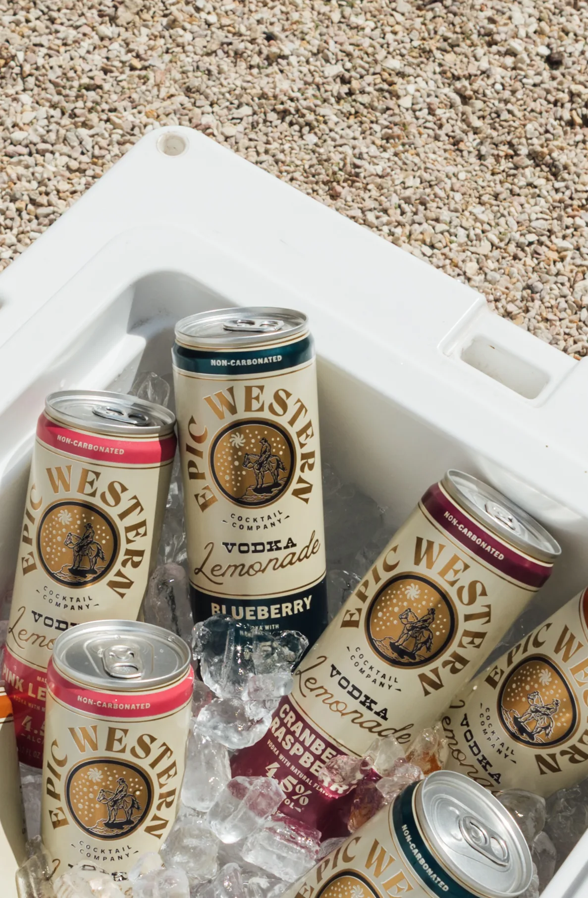 Epic Western Vodka Lemonade cans on ice in a cooler